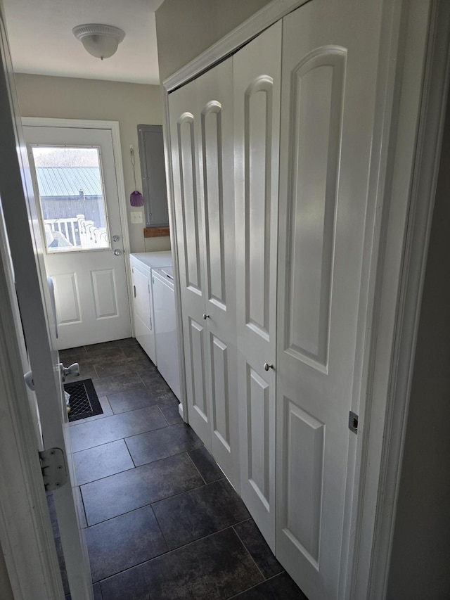 doorway to outside featuring washing machine and clothes dryer