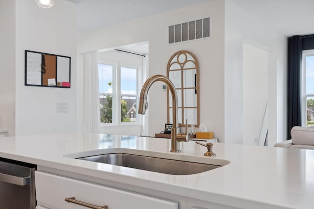 3600 Magnolia Trace Dr, Bellbrook, OH 45305 - kitchen featuring a sink, dishwasher, light countertops, and white cabinetry