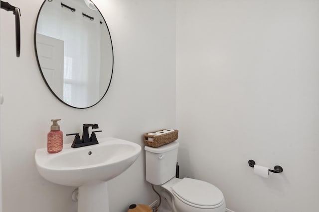 3600 Magnolia Trace Dr, Bellbrook, OH 45305 - half bathroom with toilet, a sink, and baseboards