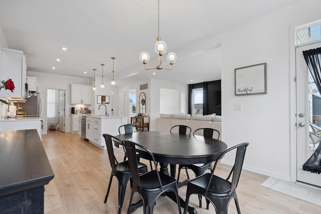 3600 Magnolia Trace Dr, Bellbrook, OH 45305 - dining room featuring light wood finished floors, a chandelier, healthy amount of natural light, recessed lighting, and baseboards