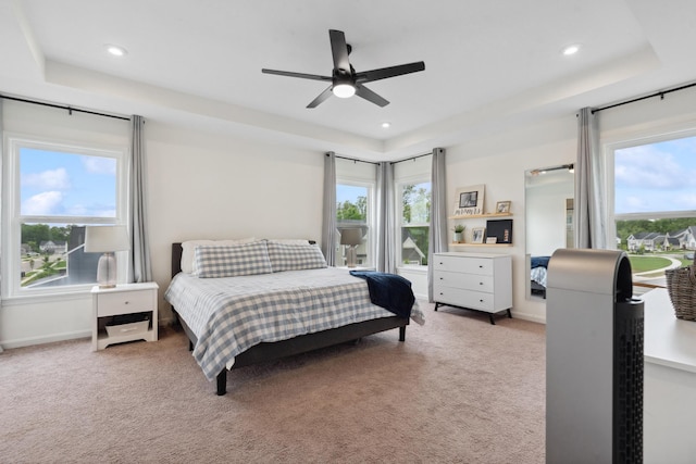 3600 Magnolia Trace Dr, Bellbrook, OH 45305 - carpeted bedroom featuring multiple windows, recessed lighting, baseboards, a tray ceiling, and a ceiling fan
