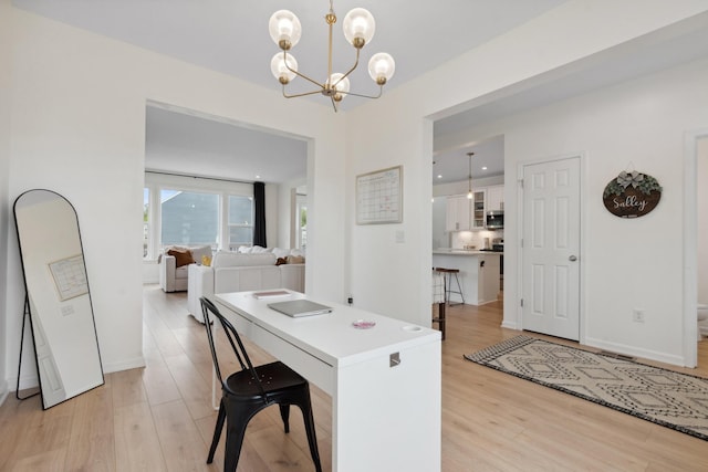 3600 Magnolia Trace Dr, Bellbrook, OH 45305 - dining area featuring light wood finished floors, a chandelier, and baseboards