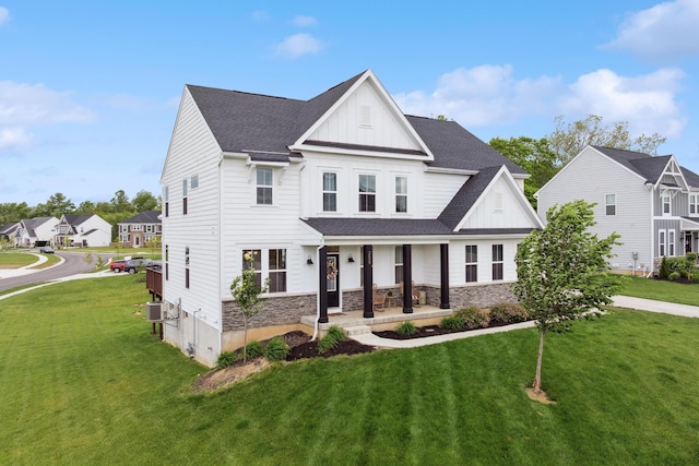 3600 Magnolia Trace Dr, Bellbrook, OH 45305 - view of front of home with a porch, board and batten siding, a front yard, and a shingled roof