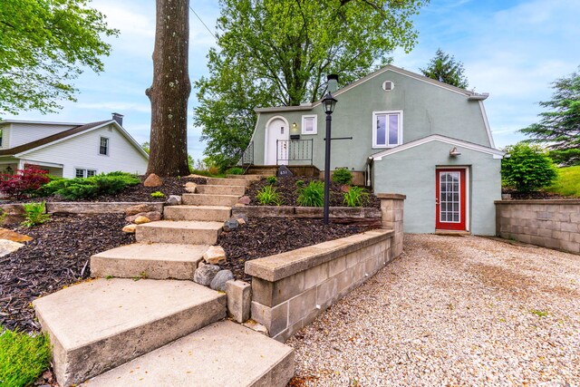 651 Eastern Ave, Bellefontaine, OH 43311 - view of front of home with stucco siding and a chimney