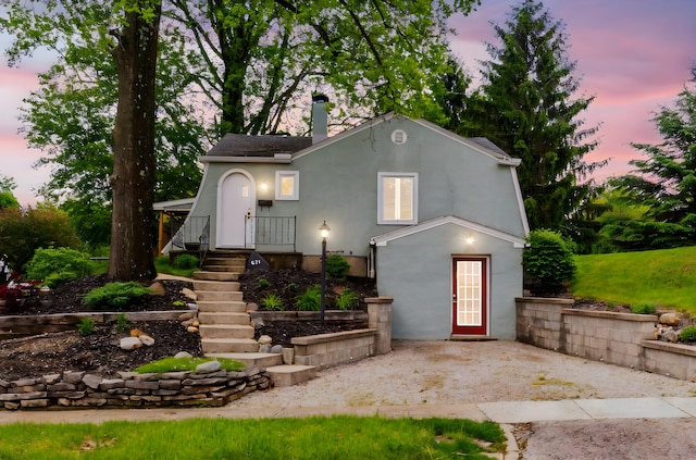 651 Eastern Ave, Bellefontaine, OH 43311 - view of front of house with a patio area and stucco siding