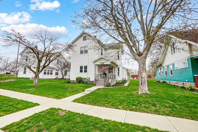 426 School St, Bradford, OH 45308 - view of front of property featuring a front yard and a residential view