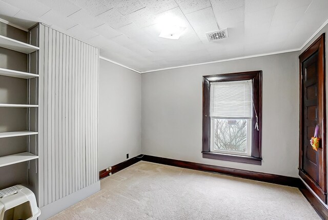 426 School St, Bradford, OH 45308 - unfurnished room with carpet flooring, visible vents, crown molding, and heating unit