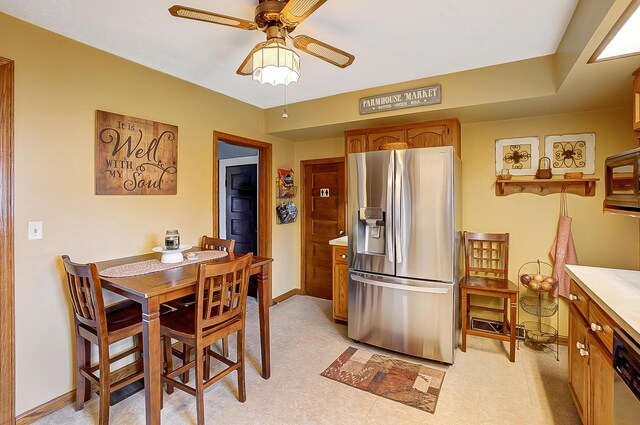 426 School St, Bradford, OH 45308 - dining area with baseboards and a ceiling fan