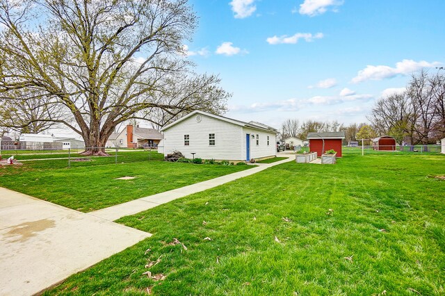 426 School St, Bradford, OH 45308 - view of yard with a storage shed and an outbuilding