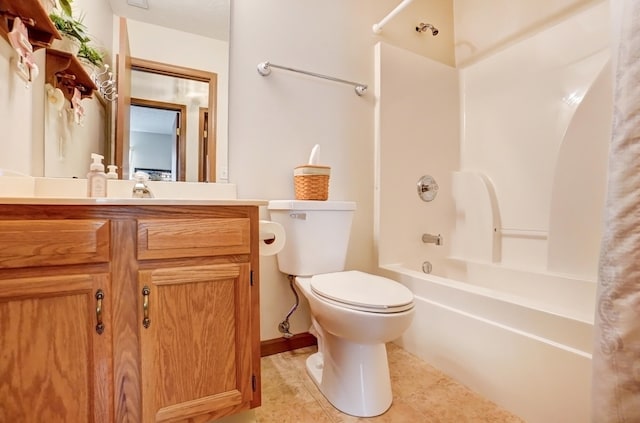 bathroom featuring vanity, toilet, tile patterned flooring, and shower / washtub combination