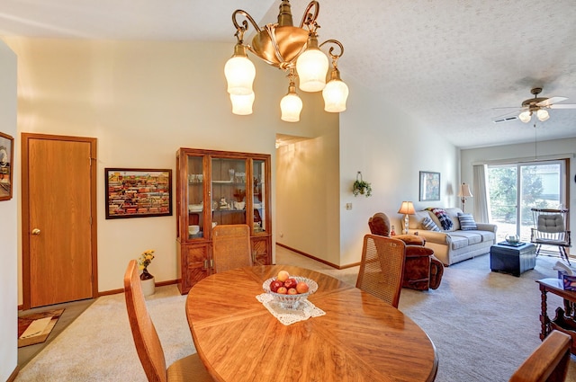 dining area with baseboards, carpet, a high ceiling, and a textured ceiling