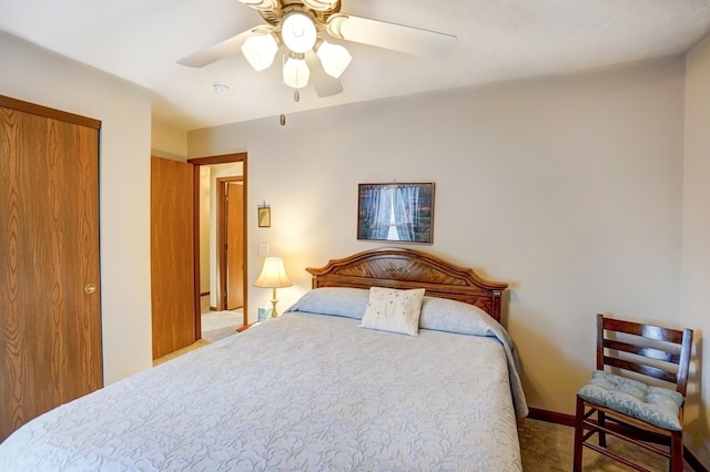 bedroom with a ceiling fan, carpet, baseboards, and a closet