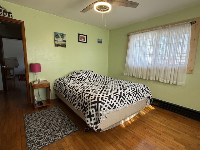 bedroom featuring hardwood / wood-style flooring and ceiling fan