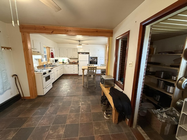 kitchen with sink, white cabinetry, ceiling fan, pendant lighting, and white appliances