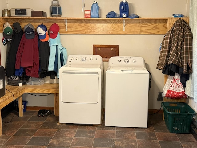 clothes washing area featuring separate washer and dryer