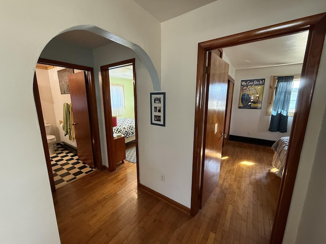 hallway with dark wood-type flooring