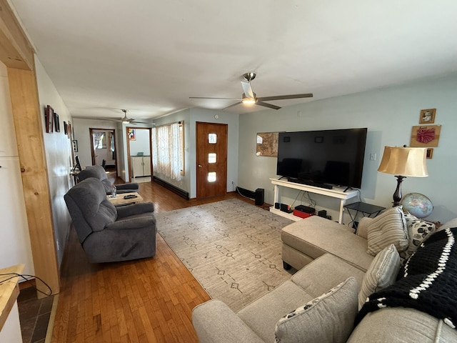 living room with wood-type flooring and ceiling fan