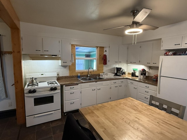 kitchen featuring sink, white appliances, decorative backsplash, and white cabinets