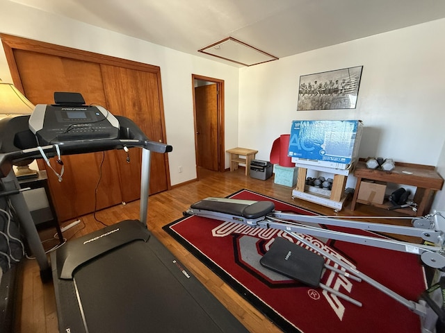 exercise room with hardwood / wood-style flooring