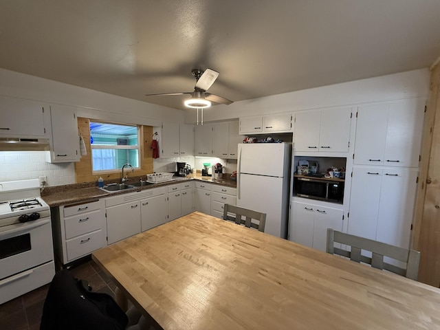 kitchen with sink, white appliances, decorative backsplash, and white cabinets