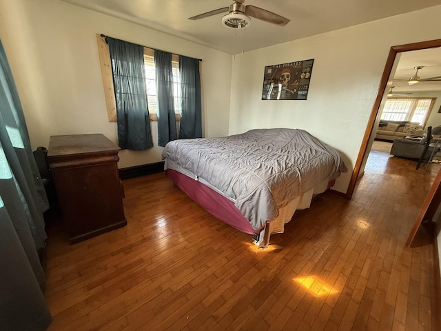 bedroom featuring hardwood / wood-style flooring and ceiling fan