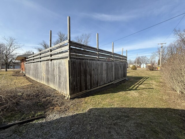 view of outbuilding featuring a yard