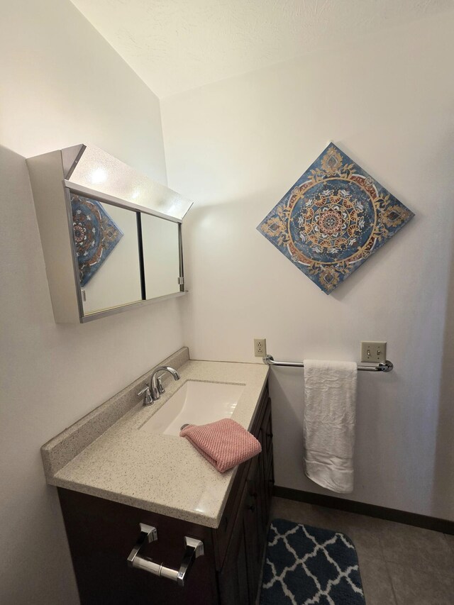 3032 Armsgate Rd Unit 25, Springfield, OH 45503 - bathroom featuring vanity and lofted ceiling