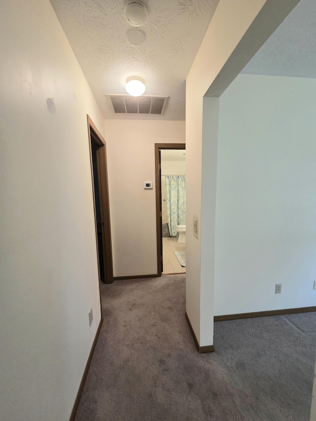 3032 Armsgate Rd Unit 25, Springfield, OH 45503 - hallway featuring carpet flooring and a textured ceiling