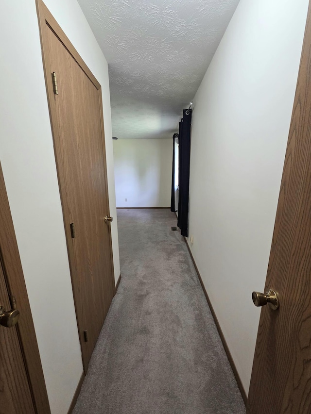 3032 Armsgate Rd Unit 25, Springfield, OH 45503 - hallway featuring light carpet and a textured ceiling