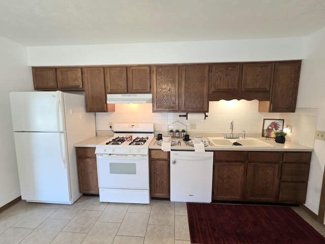 3032 Armsgate Rd Unit 25, Springfield, OH 45503 - kitchen featuring white appliances, under cabinet range hood, tasteful backsplash, and light countertops
