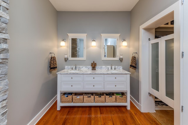 bathroom with hardwood / wood-style flooring and vanity