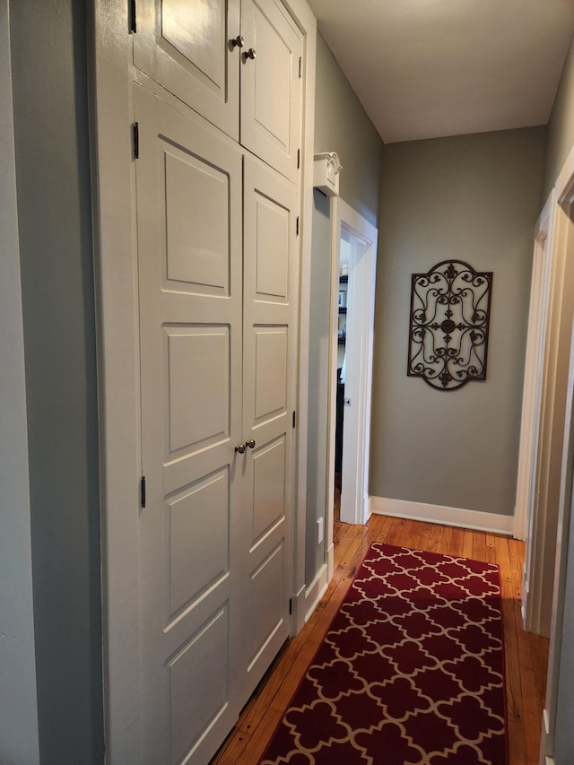 corridor featuring hardwood / wood-style flooring