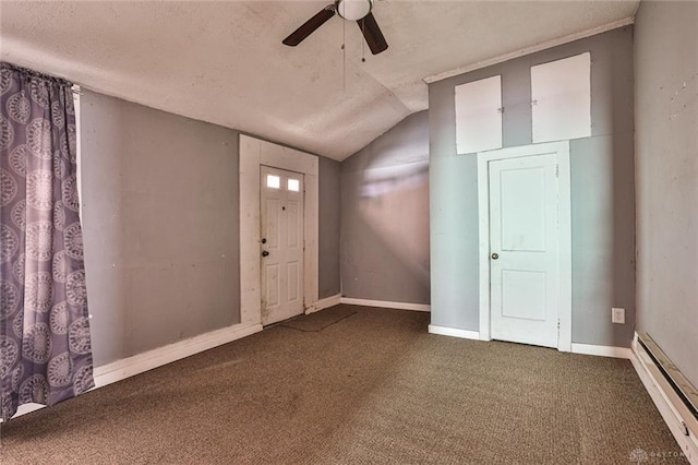 carpeted entryway with lofted ceiling, a textured ceiling, ceiling fan, baseboard heating, and baseboards