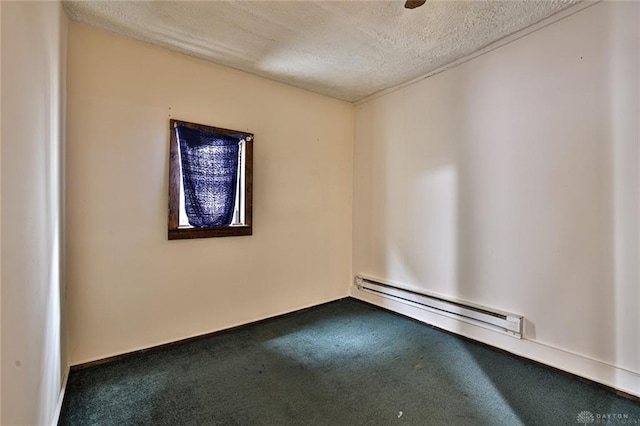 carpeted spare room featuring a textured ceiling and baseboard heating