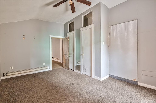 unfurnished bedroom with carpet flooring, baseboards, ceiling fan, a baseboard heating unit, and vaulted ceiling