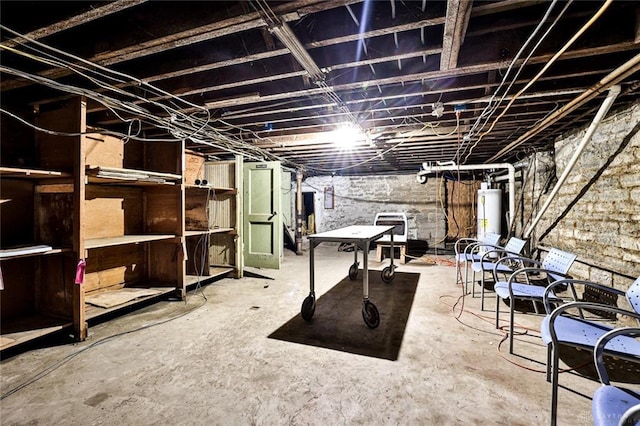 unfinished basement featuring water heater