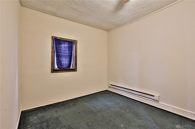carpeted empty room with a baseboard heating unit, baseboards, and a textured ceiling