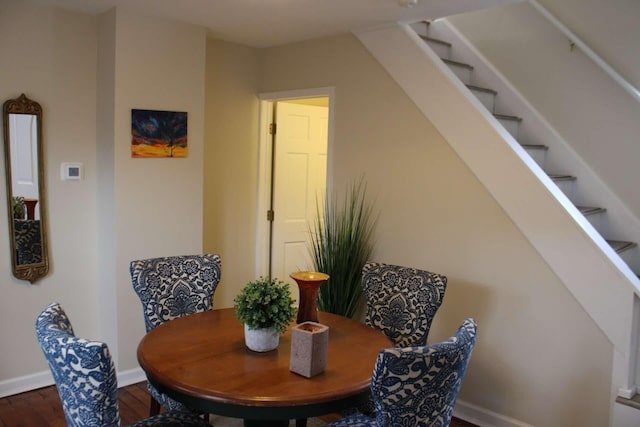 dining space featuring dark hardwood / wood-style floors