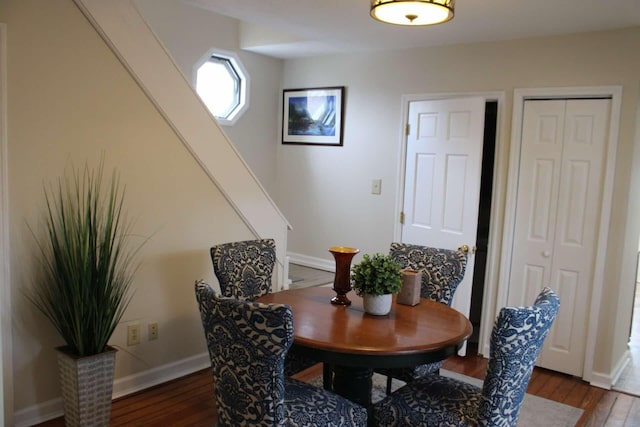 dining room with dark wood-type flooring