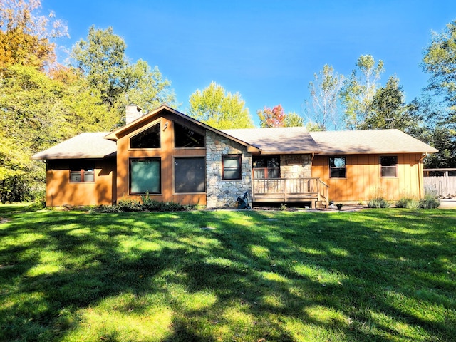 9115 New Bremen New Knoxville Rd, New Knoxville, OH 45871 - back of property featuring a chimney, a lawn, board and batten siding, and stone siding