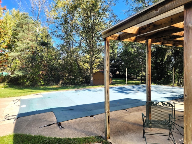 9115 New Bremen New Knoxville Rd, New Knoxville, OH 45871 - view of pool with a patio, a storage unit, a covered pool, and view of scattered trees