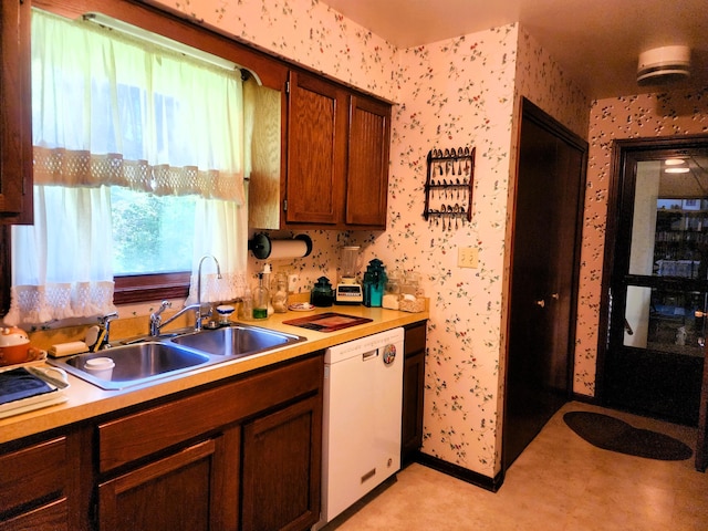 9115 New Bremen New Knoxville Rd, New Knoxville, OH 45871 - kitchen with white dishwasher, wallpapered walls, light countertops, and brown cabinets
