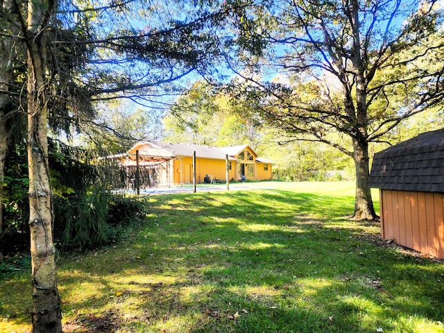 9115 New Bremen New Knoxville Rd, New Knoxville, OH 45871 - view of green lawn featuring a storage unit