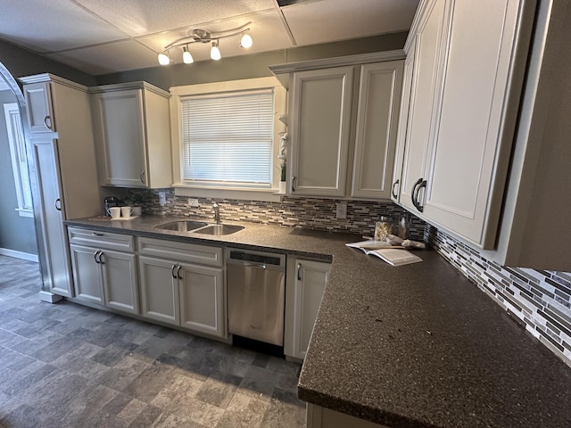 kitchen with sink, dishwasher, and decorative backsplash