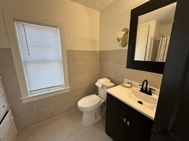 bathroom featuring tile walls, vanity, toilet, tile patterned floors, and a shower with shower curtain