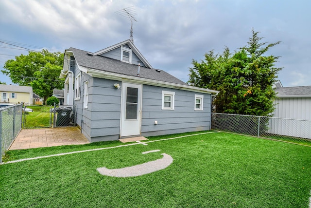 220 Williams St, Troy, OH 45373 - back of house featuring a fenced backyard and a shingled roof