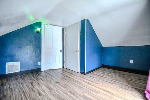 220 Williams St, Troy, OH 45373 - bonus room featuring wood finished floors and lofted ceiling