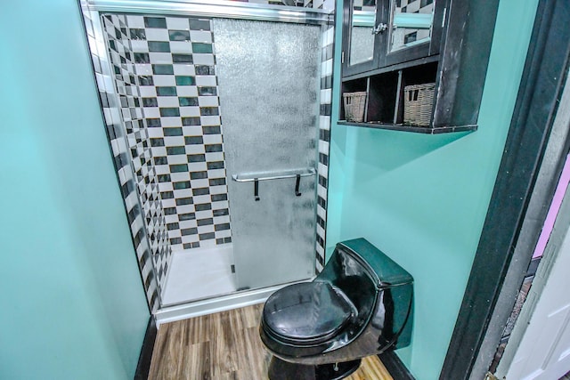 220 Williams St, Troy, OH 45373 - bathroom with a shower stall and wood finished floors