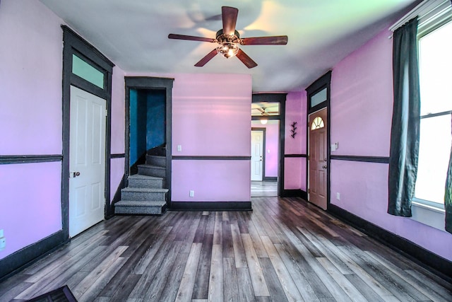 220 Williams St, Troy, OH 45373 - unfurnished living room with a ceiling fan, wood finished floors, and stairway