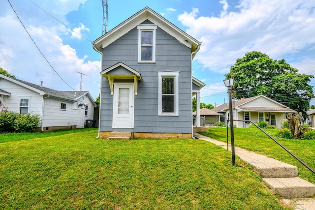 220 Williams St, Troy, OH 45373 - shotgun-style home featuring a front yard